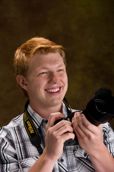 Teenager holding a Nikon camera