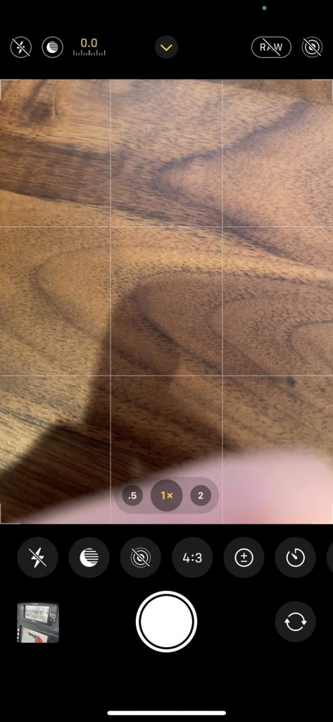 Screen shot of iPhone 12 camera with the quick access setting panel revealed.