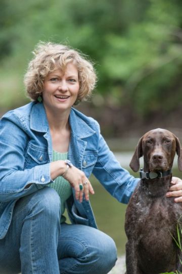 Owner with pet in natural setting Professional Pet Photographer Rochester MI